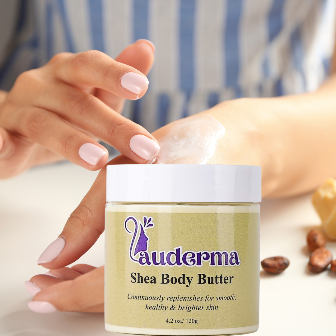 Image of someone's hand applying shea body butter on